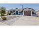 Well-maintained home exterior features a one-car garage, modern driveway, and low maintenance desert landscaping at 1003 E Marigold Ln, Tempe, AZ 85288