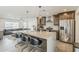 Bright kitchen with marble island, stainless steel appliances, and an open floor plan at 1003 E Marigold Ln, Tempe, AZ 85288