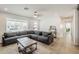 Bright and airy living room with a comfortable sectional couch, natural lighting, and easy access to other spaces at 1003 E Marigold Ln, Tempe, AZ 85288
