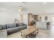 Open-concept living space with modern flooring, seamlessly connecting the living room, kitchen, and dining area at 1003 E Marigold Ln, Tempe, AZ 85288