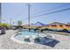 Beautiful backyard pool with lounge chairs, vibrant landscaping, and a colorful mural at 1003 E Marigold Ln, Tempe, AZ 85288