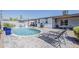 The pool area features lounge chairs and a built in BBQ, and patio at 1003 E Marigold Ln, Tempe, AZ 85288