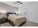 Cozy bedroom with platform bed, carpet, and natural light from window at 11334 S 52Nd Ln, Laveen, AZ 85339