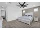 This bedroom features neutral walls, and a modern fan offering a relaxing and stylish space at 11334 S 52Nd Ln, Laveen, AZ 85339