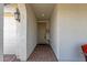 Covered entryway to the front door with brick pavers and sidelight at 11334 S 52Nd Ln, Laveen, AZ 85339