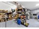 Spacious garage with ample storage shelves and work area for tools and equipment at 11334 S 52Nd Ln, Laveen, AZ 85339