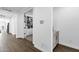 Hallway featuring wood-look tile flooring and adjacent to an office space at 11334 S 52Nd Ln, Laveen, AZ 85339