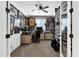 This office has a ceiling fan, collectibles, shelving, a door and two desk workspaces at 11334 S 52Nd Ln, Laveen, AZ 85339