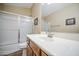 Bathroom showcases a tub/shower combo, white vanity and bright natural light at 1143 S Annie Ln, Gilbert, AZ 85296