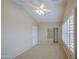 Bedroom features carpet, vaulted ceilings, ceiling fan and window with plantation shutters at 1143 S Annie Ln, Gilbert, AZ 85296