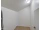 This is a closet with neutral carpet and a modern light fixture at 1143 S Annie Ln, Gilbert, AZ 85296