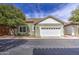 Charming home featuring a two-car garage, well-manicured lawn, and appealing curb appeal at 1143 S Annie Ln, Gilbert, AZ 85296