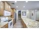 Kitchen features modern appliances, granite countertops, and a spacious island at 1143 S Annie Ln, Gilbert, AZ 85296