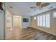 A charming living room featuring wood floors, neutral walls, and lots of natural light at 1143 S Annie Ln, Gilbert, AZ 85296