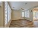 Inviting living room showcasing wood floors, neutral walls, and an abundance of natural light at 1143 S Annie Ln, Gilbert, AZ 85296