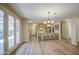 Open floor plan features living space with kitchen, dining area, and patio access at 1143 S Annie Ln, Gilbert, AZ 85296
