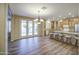 An open-concept living space that has a dining area, kitchen, and outdoor patio access at 1143 S Annie Ln, Gilbert, AZ 85296
