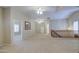 This is a spacious carpeted loft area with bright natural light and ceiling fans at 1143 S Annie Ln, Gilbert, AZ 85296