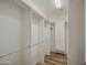 An organized walk-in closet featuring wood floors and built in shelving units at 1143 S Annie Ln, Gilbert, AZ 85296