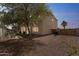 View of backyard featuring gravel landscaping and a grassy area at 120 N Pottebaum Rd, Casa Grande, AZ 85122