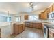 Kitchen offering tiled floors, wooden cabinets, stainless steel appliances, and lots of counter space at 120 N Pottebaum Rd, Casa Grande, AZ 85122