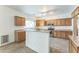 Kitchen with plenty of cabinets, tiled flooring, and stainless steel appliances at 120 N Pottebaum Rd, Casa Grande, AZ 85122