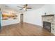 Bright and open living area with hardwood floors and view into kitchen at 120 N Pottebaum Rd, Casa Grande, AZ 85122