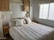 Comfortable bedroom with neutral tones, a large bed, and matching nightstands for a relaxing retreat at 1226 S Seneca Dr, Apache Junction, AZ 85119