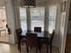 Dining area includes table, four chairs, and bright natural light at 1226 S Seneca Dr, Apache Junction, AZ 85119