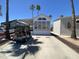 Charming mobile home with a well-maintained driveway and desert landscaping at 1226 S Seneca Dr, Apache Junction, AZ 85119