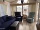 Living room with comfortable seating, and large windows allowing abundant natural light at 1226 S Seneca Dr, Apache Junction, AZ 85119