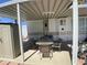 Comfortable outdoor dining area beneath the awning of this well-maintained home at 1226 S Seneca Dr, Apache Junction, AZ 85119