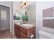 Bathroom featuring double vanity and shower-tub combo at 13353 W Gloria Ln, Peoria, AZ 85383