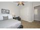 Well-lit bedroom featuring closet, desk, and ceiling fan for added comfort at 13353 W Gloria Ln, Peoria, AZ 85383