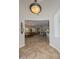 Spacious entryway showcasing tile floors, an open floor plan, and a view of the living areas at 13353 W Gloria Ln, Peoria, AZ 85383