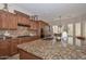 Detailed kitchen with granite counters, tile backsplash, gas cooktop, and custom cabinets at 13353 W Gloria Ln, Peoria, AZ 85383