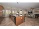 Bright kitchen showcases a large island, tile flooring, and stainless steel appliances at 13353 W Gloria Ln, Peoria, AZ 85383