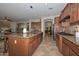Spacious open kitchen with a large island, breakfast bar, and stainless steel appliances at 13353 W Gloria Ln, Peoria, AZ 85383