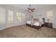 Spacious bedroom with a ceiling fan and plush carpet flooring at 13353 W Gloria Ln, Peoria, AZ 85383
