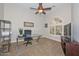 Bright office space with contemporary desk and arched window providing ample natural light at 13353 W Gloria Ln, Peoria, AZ 85383