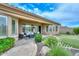 Charming patio with comfortable lounge furniture, a lush garden view, and seamless indoor-outdoor flow for relaxed living at 13353 W Gloria Ln, Peoria, AZ 85383