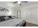 Comfortable bedroom featuring a plush bed, closet, and modern decor for a relaxing atmosphere at 13614 N 33Rd Ave, Phoenix, AZ 85029