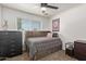 Cozy bedroom featuring a bed with storage, dresser, and soft lighting for a relaxing ambiance at 13614 N 33Rd Ave, Phoenix, AZ 85029