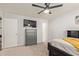Spacious bedroom features carpeted floors, dresser, a ceiling fan and natural light at 13614 N 33Rd Ave, Phoenix, AZ 85029