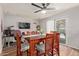 Cozy dining room with a wood table, seating for six, and wood-look laminate floors at 13614 N 33Rd Ave, Phoenix, AZ 85029