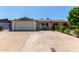 Charming single-story home with a well-maintained front yard and a two-car garage at 13614 N 33Rd Ave, Phoenix, AZ 85029