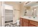 Bathroom featuring a vanity, floral floors, and an adjoining walk-in closet at 1395 E Runaway Bay Dr, Chandler, AZ 85249