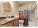 Bathroom vanity featuring a sink and granite countertop, along with desert themed shower curtain at 1395 E Runaway Bay Dr, Chandler, AZ 85249