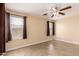 Bedroom with neutral walls, tile floors and dual windows letting in natural light at 1395 E Runaway Bay Dr, Chandler, AZ 85249