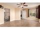 Bedroom with neutral walls and tile floors and access to the bathroom at 1395 E Runaway Bay Dr, Chandler, AZ 85249